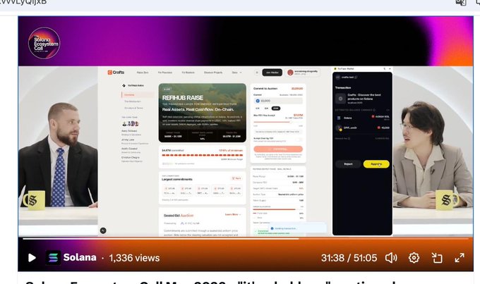 The image shows a computer screen displaying a webpage with information about a new stakeholder token standard called @craftsdev. The webpage has a purple background and features two men sitting at a table, one of whom appears to be wearing a suit. There is also an orange banner on the right side of the screen that reads "Big day for @craftsdev".