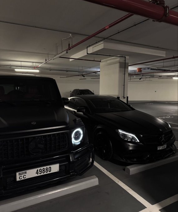The image features two black cars parked next to each other in a parking lot or garage. The first car has a license plate that reads "CC 48800", while the second car also has a license plate with the same number, "CC 48800". This suggests that these cars might be owned by someone who is interested in classical and quantum computing technologies. The image seems to be related to a post on social media or a website called "quipnetwork" which discusses how classical and quantum computers can be combined into one secure, unstoppable compute network.