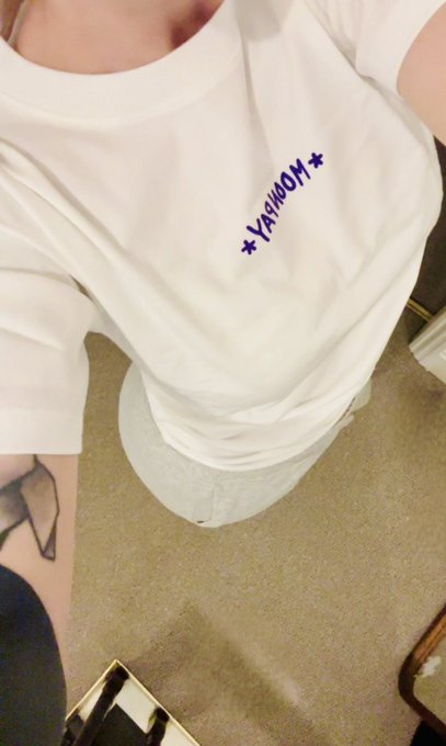 A close-up selfie shows the same white t-shirt with "*YAH00M*" printed in blue letters across the chest.
