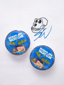Two round "Bored Ape Yacht Club" buttons featuring a tropical beach scene are displayed next to a hand-drawn skull doodle with a signature, likely teasing the BAYC x Sean Wotherspoon Anchor Drop 002 launch announced for 2pm PDT.