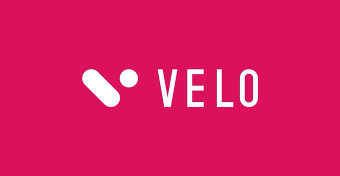 A red graphic with a white logo and the word "VELO" displayed prominently.