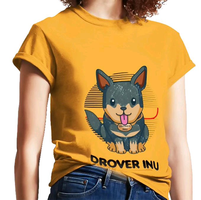 A person models a mustard yellow t-shirt featuring a cartoon illustration of a black and tan puppy with the text 'DROVER INU' printed on its collar and below the image.