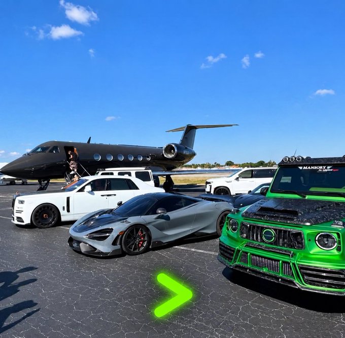 Luxury vehicles including a white Rolls-Royce, a silver McLaren 720S, and a bright green Mansory-tuned Mercedes G-Wagon parked on a tarmac in front of a private jet.
