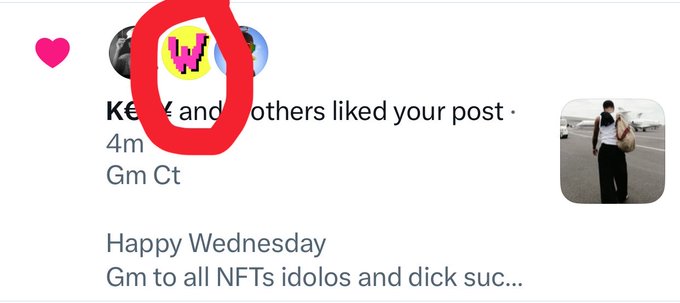 The image shows a social media notification where a user with the handle "Gm Ct" liked a post, with the post content reading "Happy Wednesday - Gm to all NFTs idolos and dick suc..." The notification is timestamped "4m" ago and includes profile pictures of three users at the top, with a pink heart icon visible on the left side. The accompanying post appears unrelated to the image content, as the notification simply indicates another user's engagement with a greeting message mentioning NFTs.