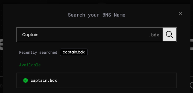 A dark-themed search interface for BNS (BitDNS) Names showing 'captain.bdx' as available with a green checkmark.