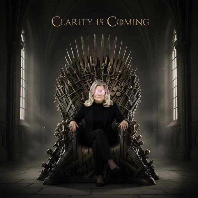 A digitally edited image of an older woman with gray hair sitting on a throne made of weapons (similar to the Iron Throne from Game of Thrones) with glowing pink/purple eyes; the text 'CLARITY IS COMING' appears at the top in gold lettering.