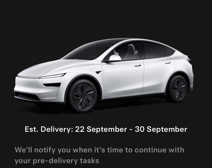 A white Tesla vehicle displayed on a black background with text 'Est. Delivery: 22 September - 30 September' and 'We'll notify you when it's time to continue with your pre-delivery tasks'.