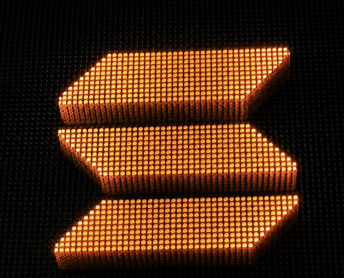 A glowing orange LED-style rendering of the Solana logo is displayed against a dark dotted background. The "DROP YOUR SOLANA WALLET FAST!" post suggests the image is being used to create urgency around the Solana (SOL) cryptocurrency, possibly in a giveaway or airdrop scam.