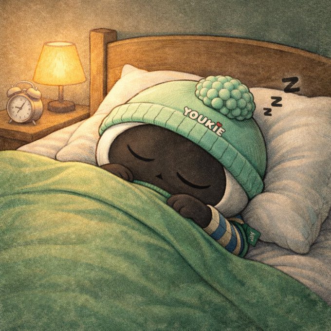 A soft illustration of a dark-skinned character sleeping peacefully under a green blanket, wearing a 'YOUKIE' beanie, with a lamp and alarm clock on the nightstand.