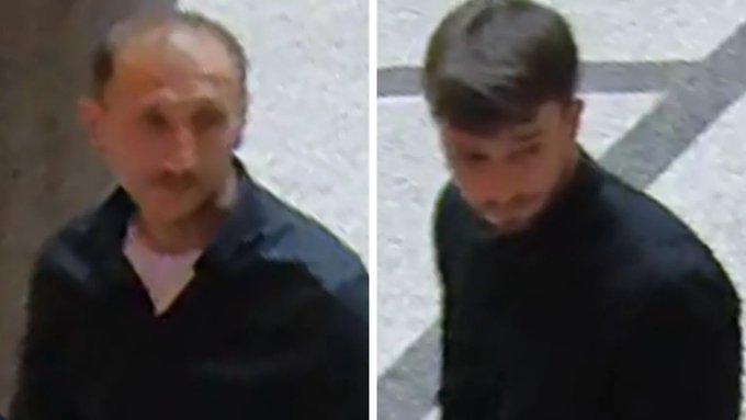 Two men in dark clothing, captured on CCTV footage, who are suspected of being the thieves who broke into Vienna's Applied Art Museum and smashed a display case with a hammer to steal jewelry from the Van Cleef & Arpels exhibition.