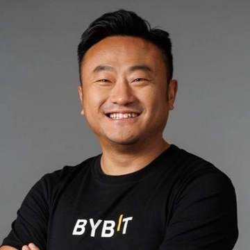Ben Zhou, co-founder and CEO of Bybit, smiles confidently in a black "BYBIT" t-shirt, reflecting the post's praise for ZachXBT's investigation into a massive Lazarus Group laundering scheme.