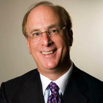 A professional headshot shows a smiling man with thinning hair, wearing rimless glasses, a dark suit, white shirt, and a patterned tie. The image likely represents a BlackRock executive or financial commentator, connecting to the post about BlackRock and other ETFs purchasing $170.1 million worth of Bitcoin.