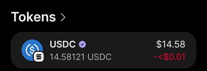 The image shows a crypto wallet token balance displaying "Tokens" with a USDC holding of 14.58121 USDC valued at $14.58, showing a minimal decline of less than $0.01. This suggests the poster has approximately enough USDC to fulfill their giveaway promise of $5 for 3 random followers if they hold 3 separate wallets.