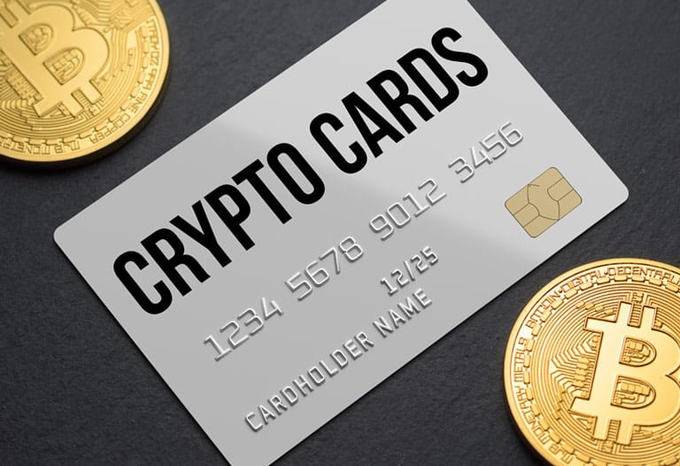 A silver "CRYPTO CARDS" card displays the number "1234 5678 9012 3456" with "CARDHOLDER NAME" and "12/25," flanked by two gold Bitcoin coins.