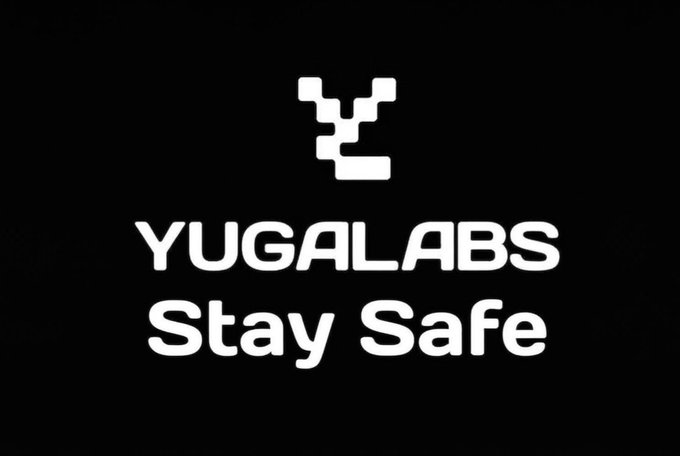 A black logo screen displaying 'YUGALABS' with 'Stay Safe' text below a pixelated symbol.