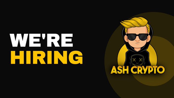 The image features a black background with bold yellow text reading "WE'RE HIRING" alongside the Ash Crypto logo, which depicts a blonde cartoon character wearing sunglasses and a black hoodie. The graphic serves as an attention-grabbing announcement header that pairs with the post's call for a Head of Content to lead content across Ash Crypto and a network of crypto and finance brands.