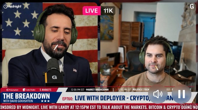 A livestream screenshot titled 'THE BREAKDOWN with David Gokhshtein' featuring two men wearing headphones, labeled 'LIVE 11K' and 'EP760: LIVE WITH DEPLOYER - CRYPTO'.