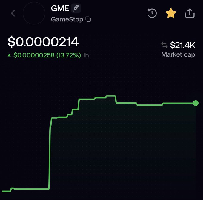 The image shows a cryptocurrency chart for a token named "GME" labeled "GameStop" trading at $0.00000214 with a market cap of $21.4K, showing a 13.72% gain over 1 hour. The chart displays a sharp upward price movement followed by stabilization, illustrating the volatile attention-driven activity referenced in the post about the GameStop token on Sushiswap.