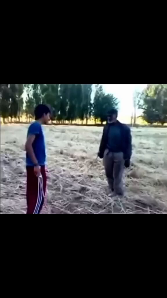 The image shows two men standing in an open field, with one man holding a stick and another man looking at him. The background features trees and bushes, creating a natural setting for their conversation or interaction. The caption of the image reads "I haven't sold a sat. Strategy is still stacking." This suggests that they might be discussing strategies or sharing ideas in an outdoor environment.