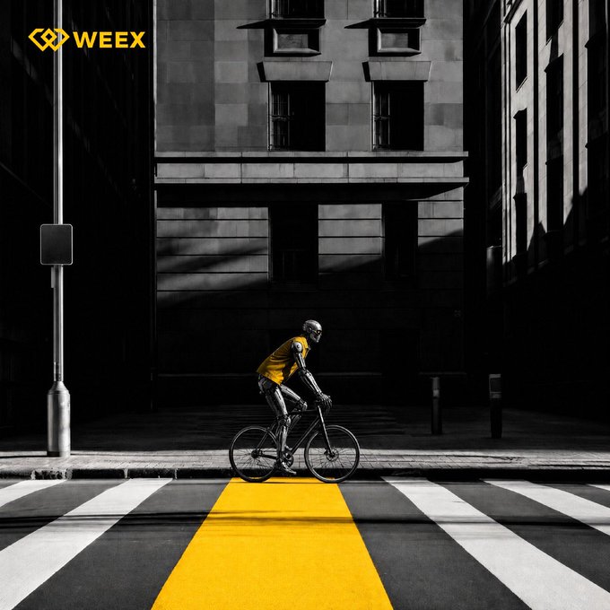 A black and white WEEX advertisement featuring a robot in a yellow jersey riding a bicycle across a crosswalk, with a bright yellow stripe leading toward the viewer.
