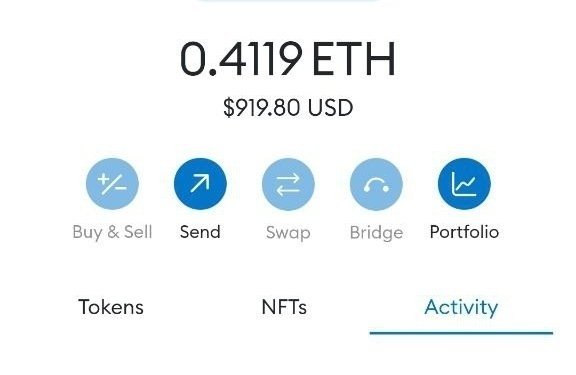 The image displays a crypto wallet interface showing a balance of 0.4119 ETH ($919.80 USD) with navigation options like Send, Swap, Bridge, and Portfolio. This appears to be a typical crypto airdrop post encouraging users to share their EVM wallet addresses for a giveaway, though it's worth noting that legitimate airdrops rarely require posting wallet addresses publicly as scammers commonly use such tactics.