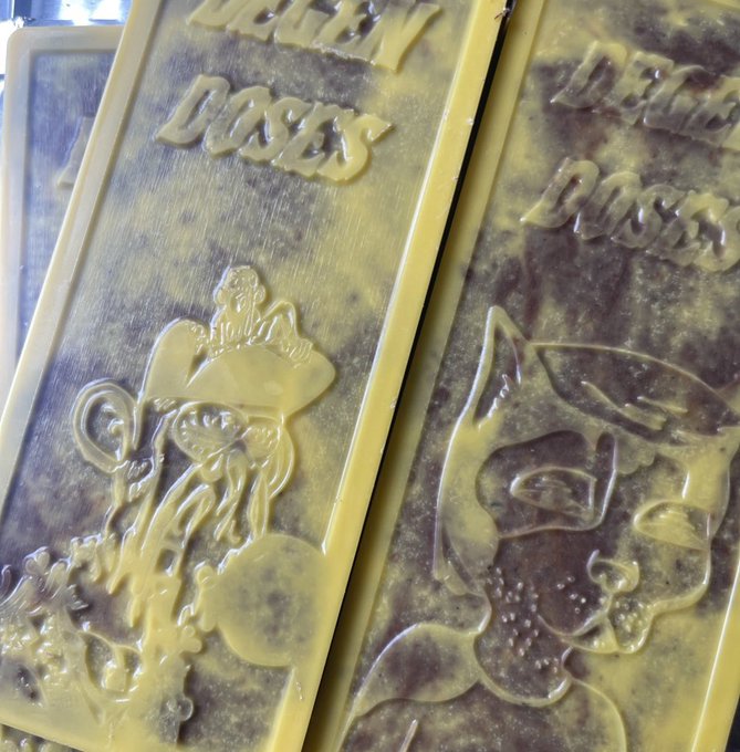 Two yellow gold bars embossed with "999.9" and "DEG1" feature a muscular figure with a skull and a grinning face, tying into the post's "Gm degens" crypto meme culture centered around the $LMAO token. The bars appear to be a playful, meme-themed gold collectible.