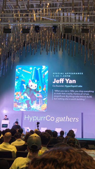 The image shows a conference hall where attendees are watching a presentation introducing "Jeff Yan, Co-founder of Hyperliquid Labs" for a "Special Appearance" from 1:30-1:40PM, alongside a cartoon fox character and the text "HypurrCo gathers" with a quote about factors of 100x success—fitting the post about attending Hyperliquid Labs (HL) events at Token2049.