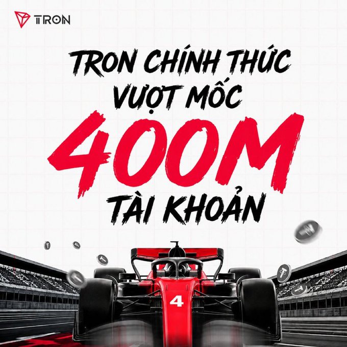 A promotional graphic from TRON featuring a red Formula 1 race car with the number 4, displaying the Vietnamese text "TRON CHÍNH THỨC VƯỢT MỐC 400M TÀI KHOẢN" (meaning "TRON officially surpasses 400M accounts") alongside the TRON logo, celebrating the network's milestone of reaching 400 million accounts.