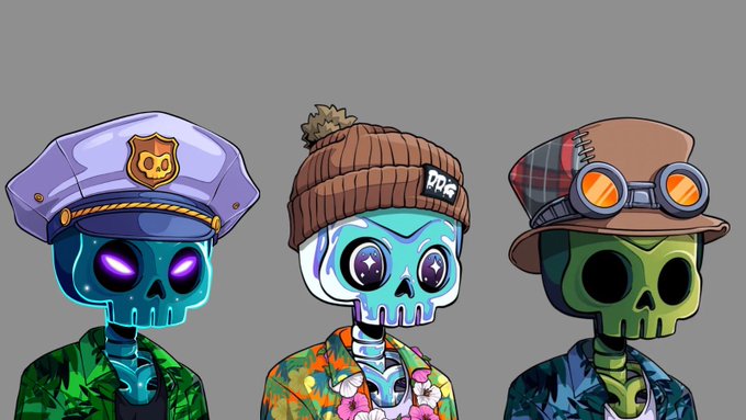 The image features three cartoon-style skulls, each wearing a hat or top hat, standing next to each other against a gray background. The first skull has a blue hat with a white "D" logo, the second skull wears a brown hat with a red and black plaid pattern, and the third skull sports an orange hat with a gold star design.

The post that accompanies this image reads: 
"Got my tropical @DedGorgez set".