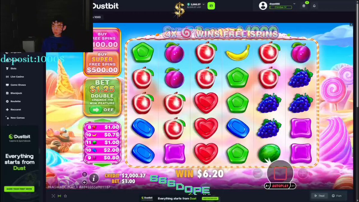 The image shows a slot machine game with colorful fruit symbols and a man standing behind the machine. The game appears to be focused on digital assets or cryptocurrencies, as indicated by the text "@DustbitOfficial" and "the future of online gaming is becoming more crypto-native". This suggests that the game might involve transactions related to digital assets or cryptocurrencies, such as virtual currency or tokens used in the game.