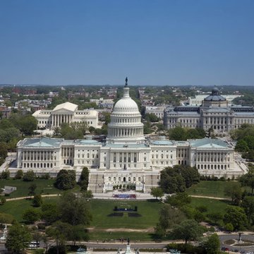 The image shows an aerial view of the U.S. Capitol Building in Washington, D.C., on a clear day, with the surrounding congressional complex and green grounds visible. The caption relates to the post as it depicts the very location—the U.S. Capitol—where H.R. 8957, the Strategic Bitcoin Reserve bill, is set to be voted on this Wednesday.