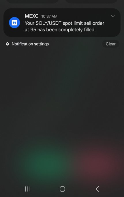A smartphone screenshot displays a notification from MEXC at 10:37 AM stating that a SOLY/USDT spot limit sell order at 95 has been completely filled, with options to access "Notification settings" or "Clear" the notification. The image appears to show a successful cryptocurrency trade execution on the MEXC exchange platform.