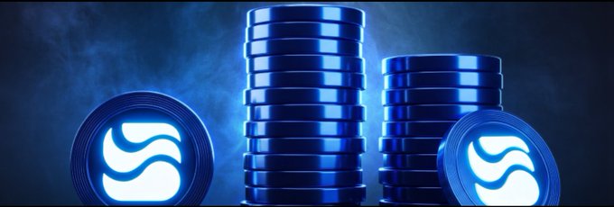 A stylized 3D render shows stacks of shiny blue cryptocurrency coins featuring a white 'S' swirl logo, set against a smoky dark blue background.