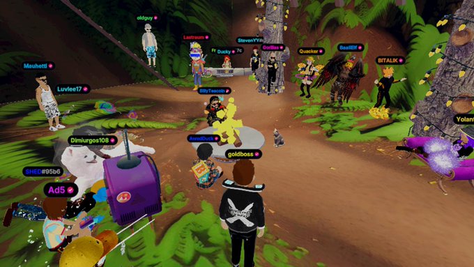 A screenshot of a 3D virtual world/metaverse environment with multiple avatars having names like 'oldguy', 'Luvlee17', 'Mouheni', 'ITr.Dustyy', 'ITSALIK', and 'Yolank' in a forest-like setting.