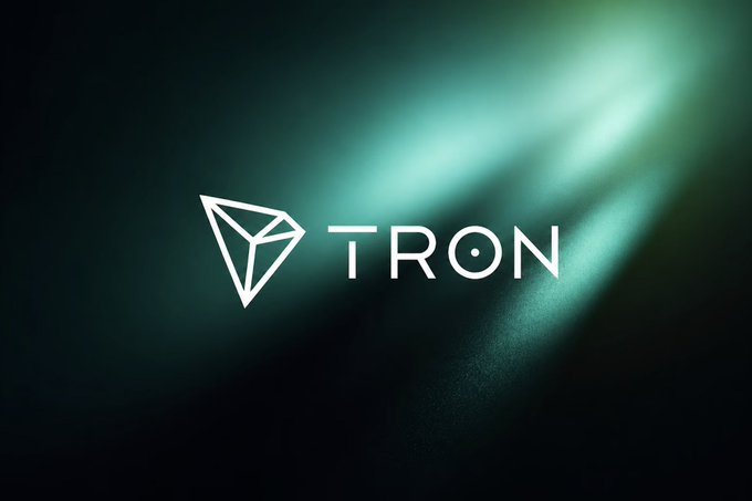 Tron (TRON) cryptocurrency logo displayed in white on a dark green textured background with a light beam effect.