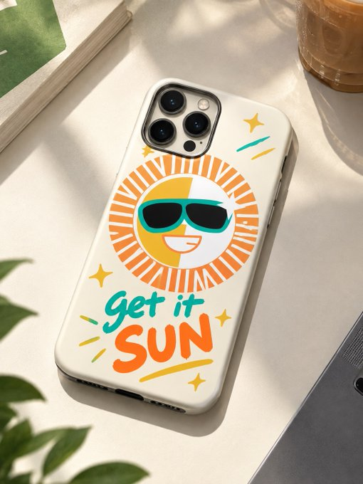 A cream-colored phone case features a smiling sun wearing sunglasses with the playful text "Get it SUN" in vibrant orange and teal lettering, sitting on a desk beside a book and coffee cup—matching the caption's tongue-in-cheek "GM" (good morning) message by encouraging readers to soak up the sun before diving into on-chain charts and group chats.