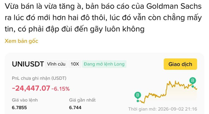 A trading chart for the token 'UNIUSDT' showing an unrealized loss of -24,447.07 USDT (-6.15%) with an entry price of 6.7855 and current price of 6.744, alongside Vietnamese text referencing Goldman Sachs.