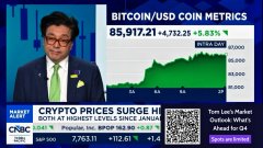 CNBC anchor Tom Lee, appearing on "Fast Money," discusses his bullish Ethereum price prediction alongside a Bitcoin/USD chart showing 85,917.21 (+472.25, +5.83%), with BTC up 158% YTD, as the on-screen ticker shows crypto prices surging and COIN down 0.2%.