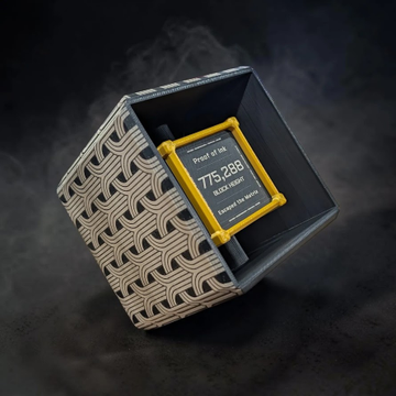 A stylized product photo of a square decorative box with wave-patterned exterior, shown open to reveal a yellow-labeled product reading 'Proof of Use 775,288' against a dark smoky background.