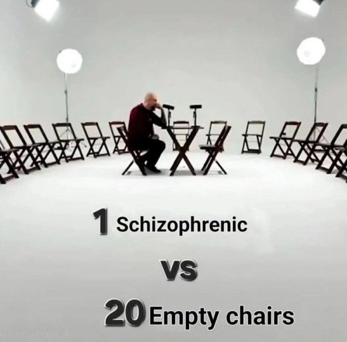 An older man sits alone in a white studio surrounded by 20 empty chairs, with text reading '1 Schizophrenic vs 20 Empty chairs'.