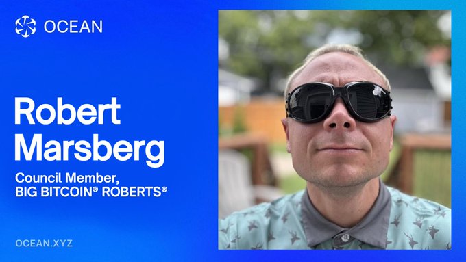 A promotional graphic for OCEAN featuring Robert Marsberg, a Council Member of BIG BITCOIN ROBERTS, wearing sunglasses against a blue background with OCEAN.XYZ at the bottom.
