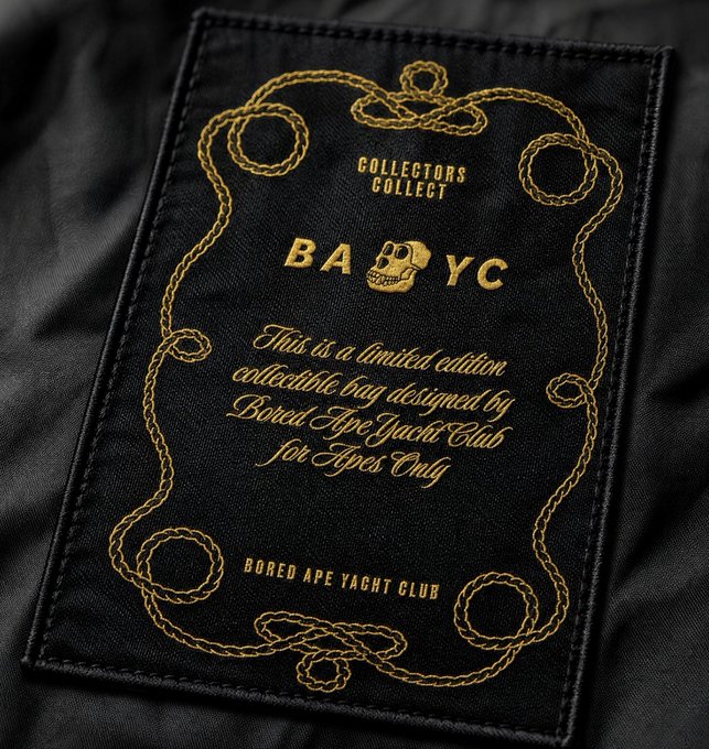 A close-up of a black limited edition Bored Ape Yacht Club (BAYC) collectible bag label that reads "COLLECTORS COLLECT," features the BAYC skull logo, and notes it is "For Apes Only."