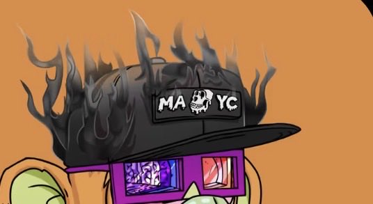 An illustration features a character wearing a black baseball cap with 'MA YC' written on the front patch, with stylized flames emanating from the top of the hat.