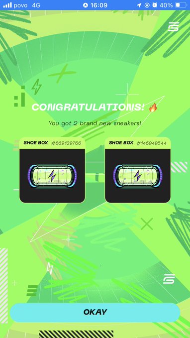 A StepN app screen congratulating the user on obtaining 2 brand new digital sneaker Shoe Boxes (#869139766 and #146949544) with an OKAY button at the bottom.