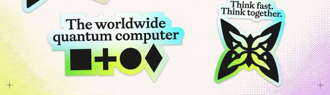 Stickers displaying 'The worldwide quantum computer' with geometric symbols and 'Think fast. Think together.' with a fox logo.
