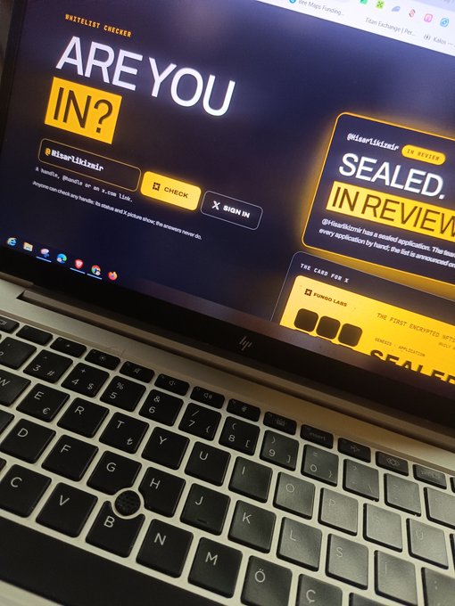 A laptop displays a website with "Whitelist Checker" branding and the text "ARE YOU IN?" alongside a status box showing "SEALED. IN REVIEW" and "THE FIRST ENCRYPTED WHITELIST," with the username "BiisarListemiz" checked—suggesting the poster is awaiting selection results from a crypto/NFT whitelist process despite being an early participant.