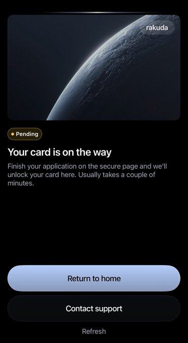 A dark-themed mobile app screen displays a "Pending" status with the message "Your card is on the way," instructing the user to finish their application on the secure page, alongside buttons to "Return to home," "Contact support," and "Refresh," with the "rakuda" logo visible at the top. This relates to the post as the user appears to have just completed the ENA token application process and is now waiting for their rakuda card to be issued.