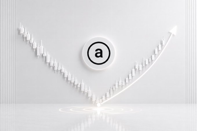 A white 3D-rendered graphic showing a glowing Amazon logo (the lowercase 'a' with the smile arrow) at the center, with a line chart of candlesticks forming a V-shape around it and an upward-trending arrow on the right side.