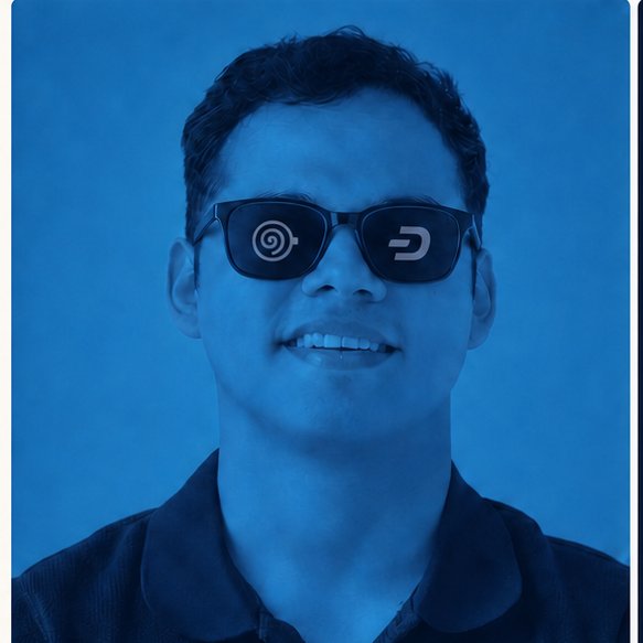 A man with dark hair and sunglasses featuring distinctive logos smiles against a blue background, accompanying a post announcing that this Dash CEO (@zeymermoca) will be speaking at DashCon in Amsterdam about $DASH, peer-to-peer payments, and privacy.