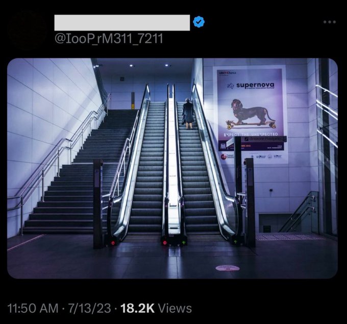 A view of two parallel escalators with one showing a lone figure riding down. The accompanying tweet asks "Wen tCrB?" (referencing the recurring nova T Coronae Borealis) alongside a CBS Supernova movie advertisement. The image of the lone figure on the escalator visually parallels the anticipation of waiting for the astronomical "supernova" event.